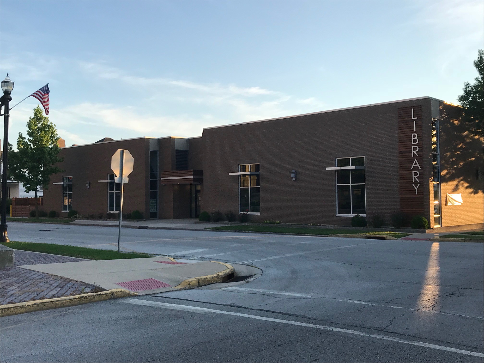 front of the Wapakoneta library building at dusk